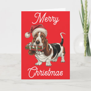 Basset Hound in Santa hat present in mouth Card