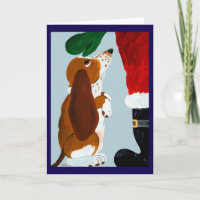 Basset Puppy getting a pet from Santa
