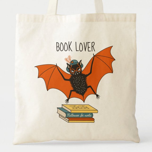 Bat Granny Book Lover Tote Bag (close up of a canvas tote bag with flying funny cartoon bat librarian and the text book lover)