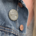 Be a Traveller Not a Tourist Map Typography Quote 6 Cm Round Badge<br><div class="desc">Our wanderlust-inspiring quote button features "Be a Traveller,  Not a Tourist" in white monoline block & script typography,  adorned with two arrow illustrations and overlaid on a sepia tone vintage 1708 world map from the New York Public Library digital archives.</div>