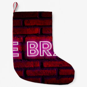 Be brave inspirational quote neon effect text on o small christmas stocking