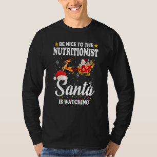 Be Nice To The Nutritionist Santa Watching Xmas T-Shirt
