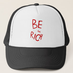 BE The Rich AOC Dress Political Message Trucker Hat