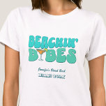 Beach Bachelorette Party Groovy Beachin Babes T-Shirt<br><div class="desc">Make a splash at your upcoming bachelorette party with this stunning beach bachelorette party personalised t-shirts. Whether you're celebrating a bach trip, a girls' vacation, or a best friends' holiday, this custom beach bachelorette party t-shirts are the perfect addition to your unforgettable getaway. Add a personal touch to your bachelorette...</div>