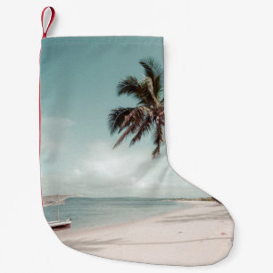 Beach beside coconut palm tree small christmas stocking