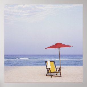 Beach Chair And Umbrella By Ocean Poster