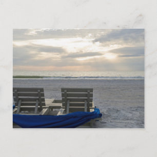 Beach chairs on St. Pete's beach at sunset. Postcard