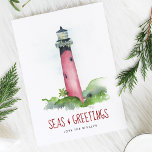 Beach Christmas Cards Watercolor Lighthouse<br><div class="desc">Celebrate Christmas in July or the 2025 holiday season with these beach Christmas cards featuring a hand-painted watercolor lighthouse inspired by the iconic Jupiter Inlet Lighthouse in Florida. This coastal lighthouse scene is decked out in festive garland and paired with the playful nautical greeting “Seas and Greetings” in a bold...</div>