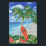 Beach Christmas Tea Towel<br><div class="desc">Happy Holidays from the warm sandy beaches of your favourite tropical island beach. Palm tree decorated with Christmas ornaments and lights,  with a retro surfboard leaning against the Christmas tree.</div>