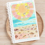 Beach Happy Place Planner<br><div class="desc">Appreciate the beauty of original and unique art as you plan your days, weeks, and months ahead. Stay organised and inspired and embrace productivity and creativity with our Happy Place Monthly Planner featuring a charming illustration of a seashell filled beach at sunrise. The cheerful and joyous vibe, accompanied by bright...</div>