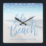 Beach House | Life Is Better At The Beach Square Wall Clock<br><div class="desc">Modern wall clock featuring string lights,  a beach image and personalised with your your family name. The clock would make an gift for anyone who owns a boat or beach house. The fonts style,  size and colour can all be changed by clicking on the customise further link after personalising.</div>