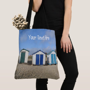 Beach huts blue skies sand english seaside photo tote bag