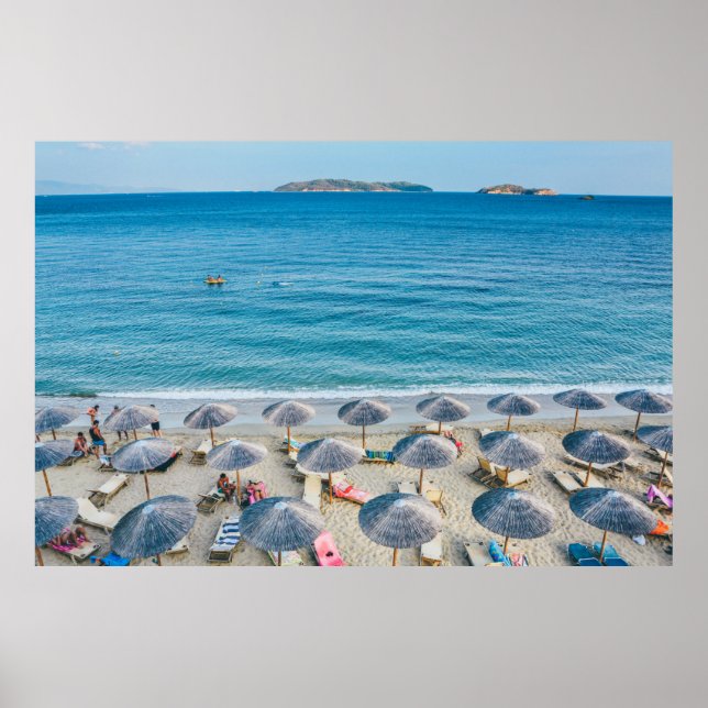 Beach lounge on seashore facing the sea poster (Front)