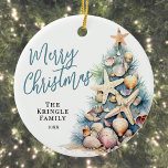Beach Merry Christmas Ceramic Tree Decoration<br><div class="desc">Celebrate the season with this festive and beachy round Christmas ornament, perfect for a coastal holiday celebration. The design features a whimsical Christmas tree made of beach shells, starfish, and coral, bringing a fun tropical touch to your holiday decor. The colour palette includes soft teal blue and tan tones for...</div>