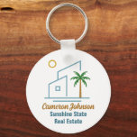 Beach Real Estate Company Cute Customisable Key Ring<br><div class="desc">This cute tropical real estate company keychain features a modern blue beach house with a cool coastal palm tree and island sun. Customise this marketing item with your agent and realty business name for home buying clients along the coast.</div>