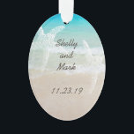Beach Scene Starfish Wedding Favour Ornament<br><div class="desc">Customise this tropical themed wedding favour ornament with text on both sides. Two starfish / sea stars are printed over a turquoise ocean and beach image to represent the newlywed couple. Names and wedding date can be printed on the front, with place of marriage on the back. Use as a...</div>