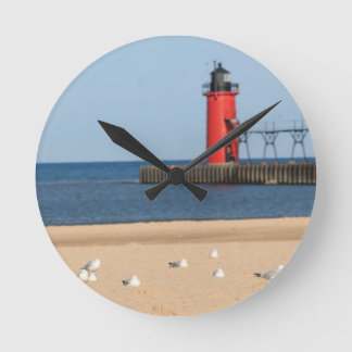 Beach scene with seagulls and lighthouse round clock