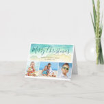 Beach Vacation Christmas Photo Holiday Folded Card<br><div class="desc">Send warm season's greetings with this beach-themed Christmas card. The coastal holiday photo card features a sea green watercolor wave upon a sandy shore. Editable text atop the wave reads "Merry Christmas" in blue-green calligraphy lettering. Three photos are located below the painted wave. To personalise, add your names and three...</div>