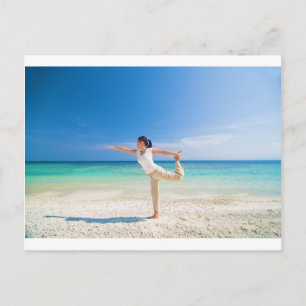 beach yoga performed by a matured asian female postcard