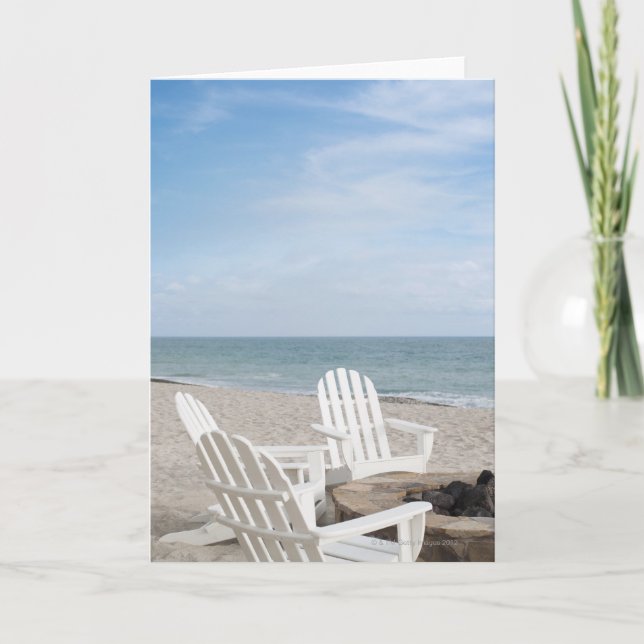 beachfront house with adirondack chairs and card (Front)