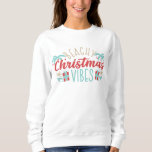 Beachy Christmas Vibes Tropical Summer Beach Sweatshirt<br><div class="desc">Beachy Christmas Vibes Tropical Summer Beach Christmas Holiday Sweatshirts features a fun Christmas design with text "Beachy Christmas Vibes" in modern script typography accented with seashells,  palm trees and gifts. Perfect for a summer or tropical Christmas and the holidays. Created by Evco Holidays www.zazzle.com/store/evcoholidays</div>