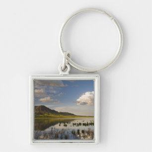 Bear Butte reflects into Bear Butte Lake near Key Ring