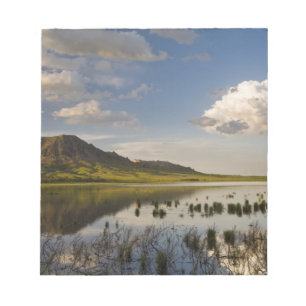 Bear Butte reflects into Bear Butte Lake near Notepad
