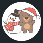 Bear With Snowman In Winter For Christmas Classic  Round Sticker<br><div class="desc">Bear with snowman in winter for Christmas - a snowman for winter and Christmas. A winter greeting in the cold season for the holidays. Christmas bear with snowman.</div>