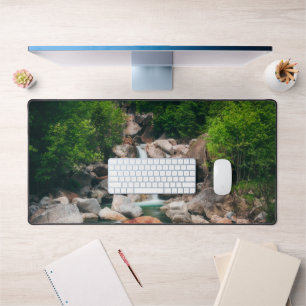 Beautiful cascading river in spring desk mat
