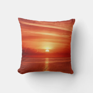 Beautiful colourful sunrise at the sea with dramat cushion