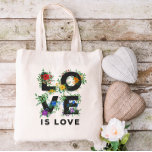 Beautiful Floral Love Is Love Pride Tote Bag<br><div class="desc">Pride tote bag with LOVE IS LOVE written in bold black letters decorated with greenery,  berries,  and flowers in red,  orange,  yellow,  green,  blue,  and purple,  inspired by the rainbow pride flag colours.</div>