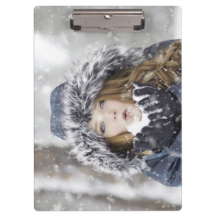 Beautiful Girl in a Winter Coat with Snow Clipboard