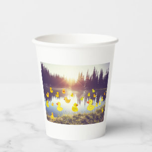 Beautiful lake in the sunrise with plastic dack paper cups