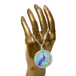 Beautiful Peacock and Roses Silver Plated Necklace<br><div class="desc">pop of blue,  a gorgeous eleganteotic bird,  with flowers and soft blue background.</div>