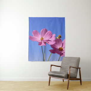 beautiful pink flowers hugging a clear blue sky tapestry