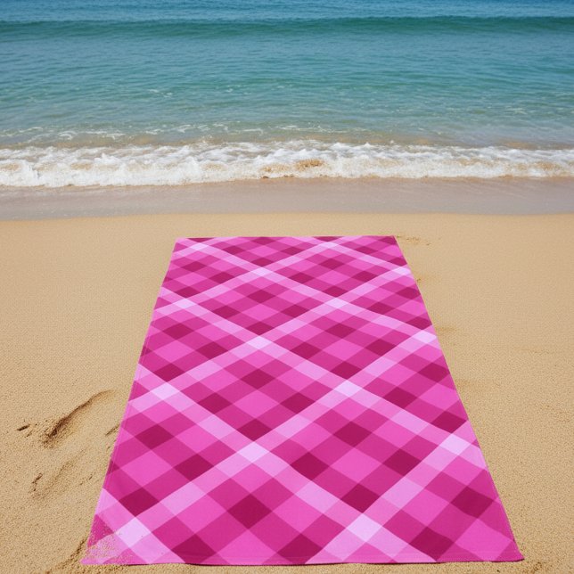 Beautiful Pink Magenta Plaid Beach Towel (Beautiful Pink Magenta Plaid Beach Towel on sand on a beach by the ocean.)