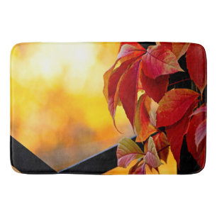 Beautiful red vine leaves in the autumn garden bath mat