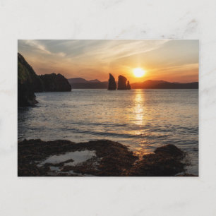 Beautiful seascape: view of rocks in sea at sunset postcard