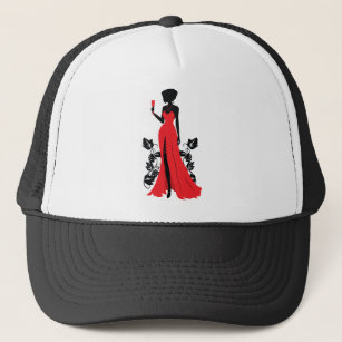 Beautiful silhouette of young woman with wineglass trucker hat