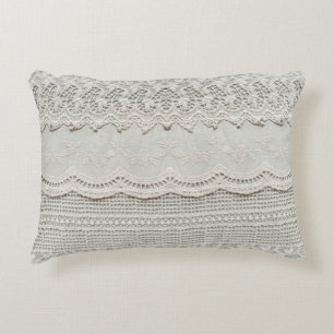 Beautiful, subtle, white laced textile close up.  decorative cushion