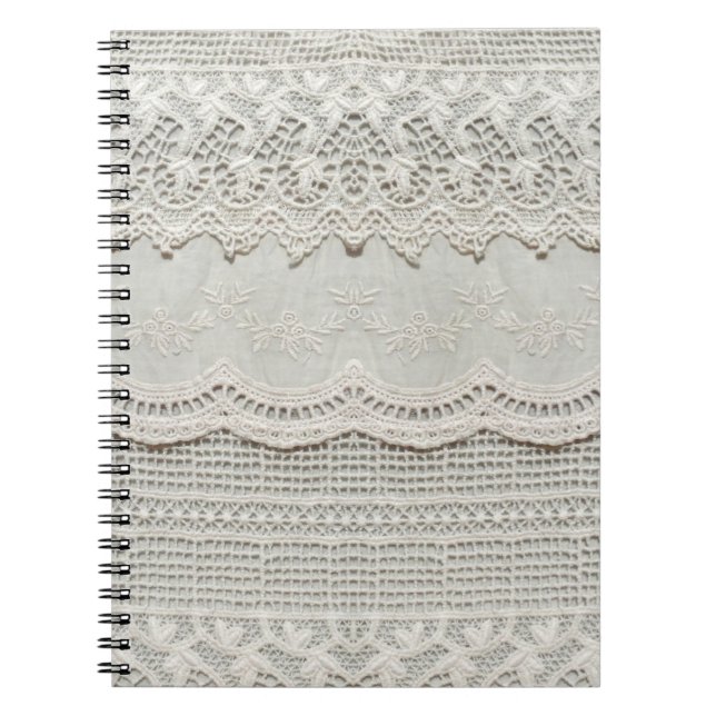 Beautiful, subtle, white laced textile close up.  notebook (Front)