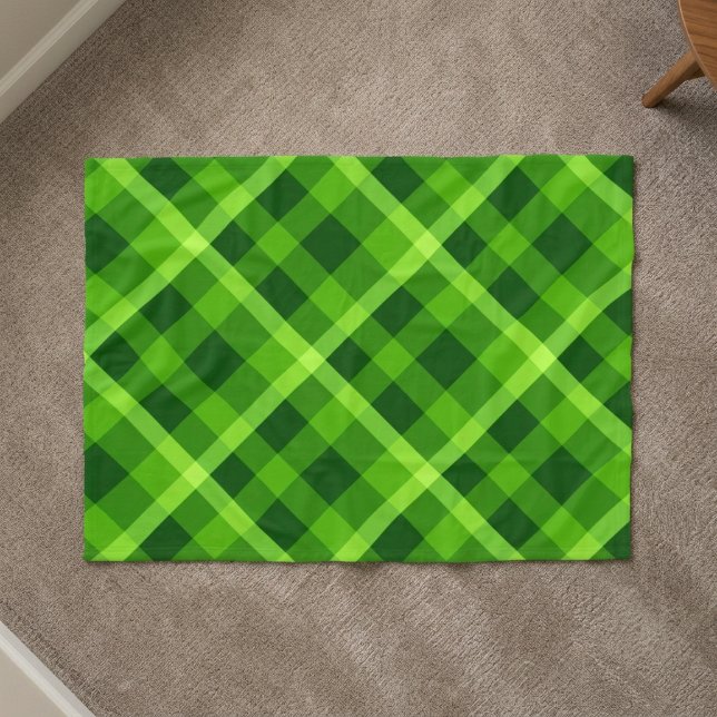 Beautiful Tree Green Plaid Small Fleece Blanket (Top down view of Beautiful Tree Green Plaid Small Fleece Blanket on a carpet floor in a home.)