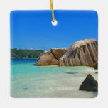 Beautiful Tropical Sea with a Rocky Beach Ceramic Ornament<br><div class="desc">An ornament with a photograph of a turquoise blue ocean beach with big rocks scattered along the coast. Bright and sunny tropical locale.</div>