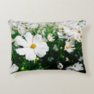 Beautiful white cosmos flowers blooming in gardena decorative cushion