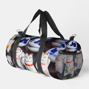 Beckoning cat figurines duffle bag