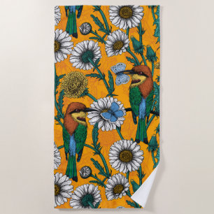 Bee-eaters, blue butterflies and daisies on orange beach towel