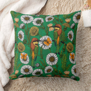 Bee eaters on a spring meadow cushion