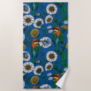 Bee eaters on blue beach towel