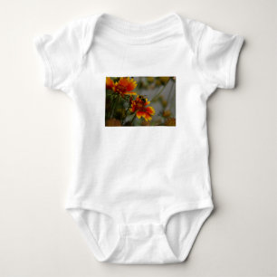Bee foraging on a flower baby bodysuit
