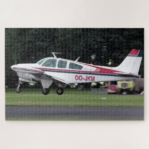 Beechcraft Bonanza OO-JKM – Kemble Airfield  Jigsaw Puzzle